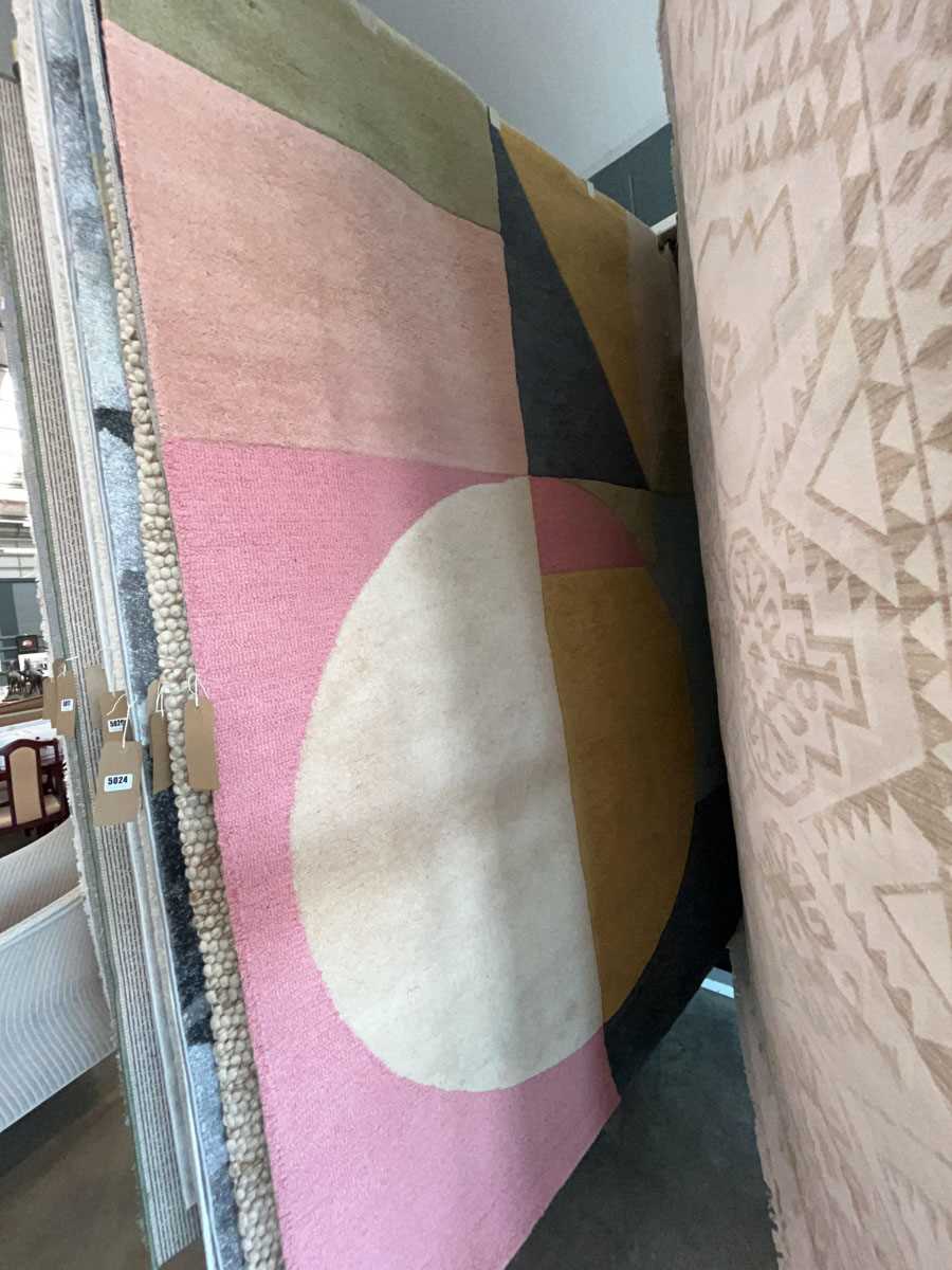 Lot 5028 - Multicoloured carpet with geometric pattern