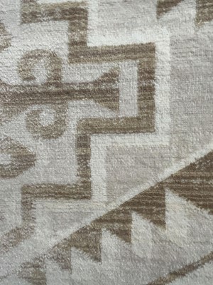 Lot 5029 - Pale beige and brown carpet with geometric...