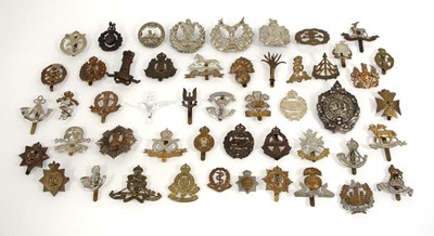 Lot 89 - A group of cap badges including Tank Corps,...