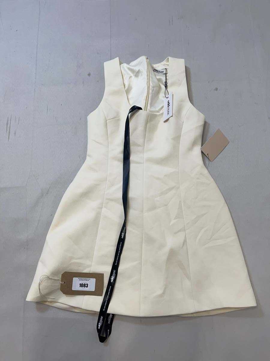 Lot 1083 - Oddmuse cotton mix volume mini dress in ecru...