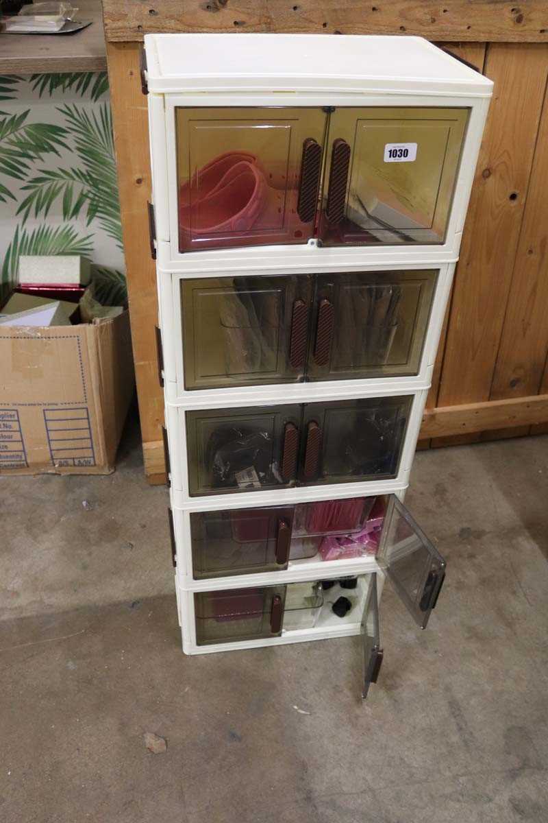 Lot 5 tiered plastic storage unit with contents to...