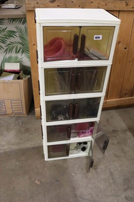 Lot 5 tiered plastic storage unit with contents to...