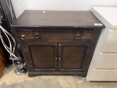 Lot 1306 - Dark oak cupboard with single upper drawer