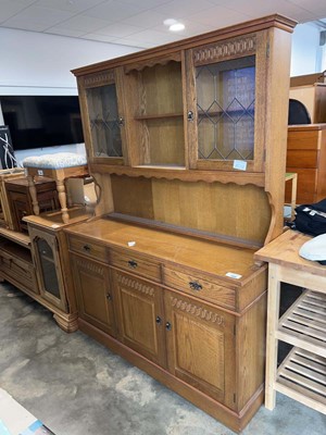 Lot 1308 - Dark oak finish dresser with leaded glass doors