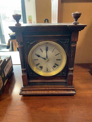 Lot 1329 - Dark oak cased mantel clock