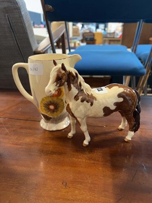 Lot 1357 - Beswick horse and a Clarice Cliff patterned jug