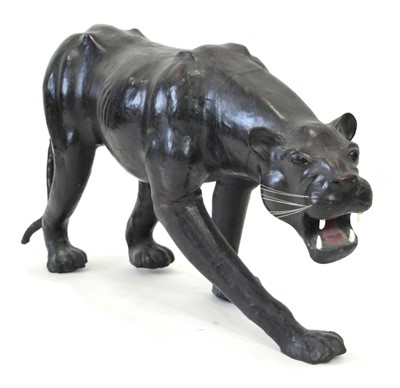 Lot 22 - A large leather figure modelled as a panther,...
