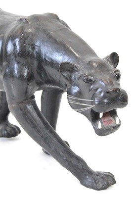 Lot 22 - A large leather figure modelled as a panther,...