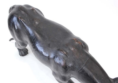 Lot 22 - A large leather figure modelled as a panther,...