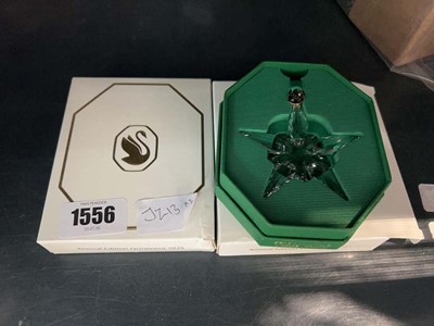 Lot 1556 - 2 Swarovski Annual Edition ornaments from 2025