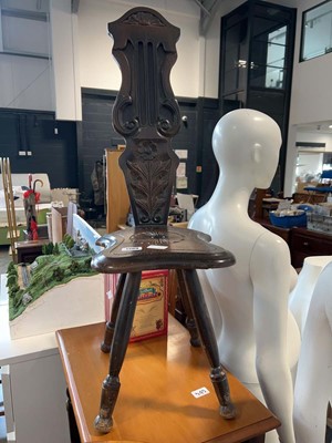 Lot 1409 - Dark oak stool with carved back