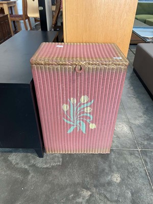 Lot 1421 - Lloyd Loom pink and gold laundry basket