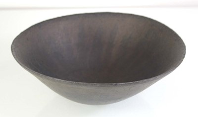 Lot John Ward (1938-2023), a black glazed...