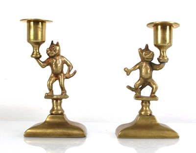Lot 171 - Felix the Cat: A pair of brass candlesticks, h....