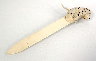 Lot 172 - Dismal Desmond: A celluloid letter opener/tape...