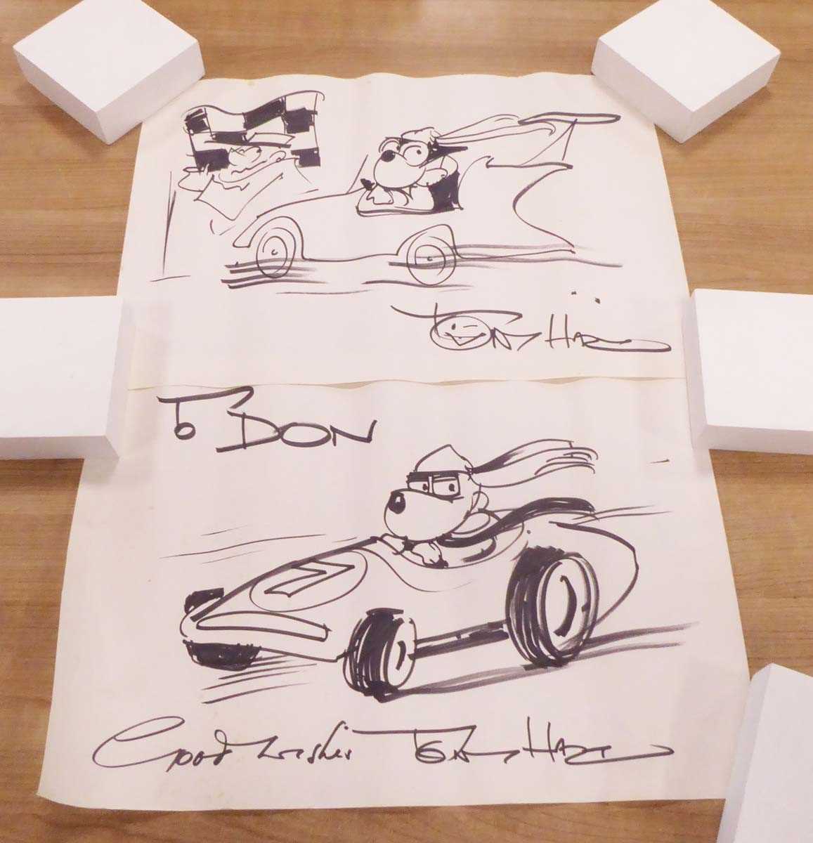 Lot 13 - Tony Hart (1925-2009), A dog in a racing car,...