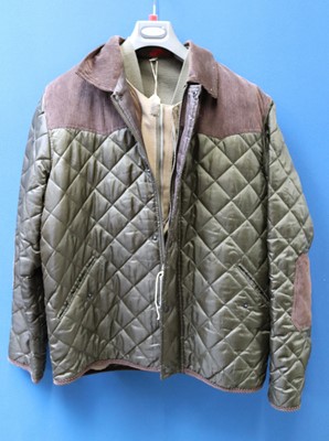 Lot 1202 - A quilted shooting jacket, target shooting...