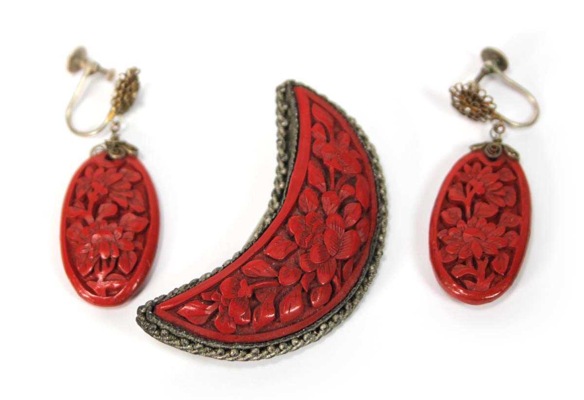Lot 501 - A cinnabar lacquer brooch of crescent moon...