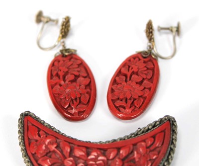 Lot 501 - A cinnabar lacquer brooch of crescent moon...