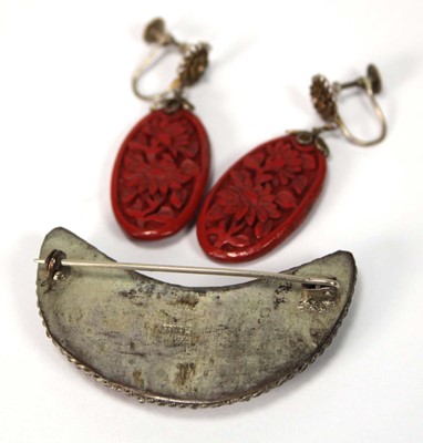 Lot 501 - A cinnabar lacquer brooch of crescent moon...