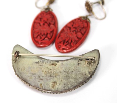 Lot 501 - A cinnabar lacquer brooch of crescent moon...