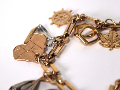 Lot 507 - A 9ct yellow gold rectangular and round link...
