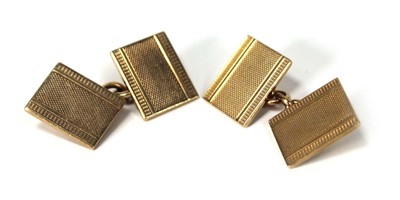 Lot 509 - A pair of 9ct yellow gold engine turned...