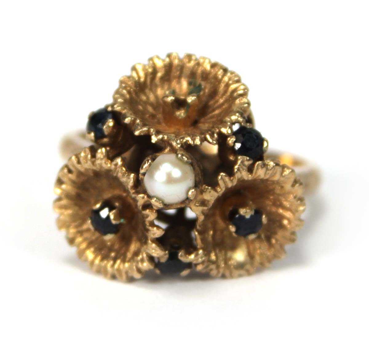 Lot 514 - A 9ct yellow gold ring set small sapphires and...