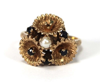 Lot 514 - A 9ct yellow gold ring set small sapphires and...