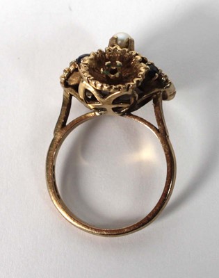 Lot 514 - A 9ct yellow gold ring set small sapphires and...