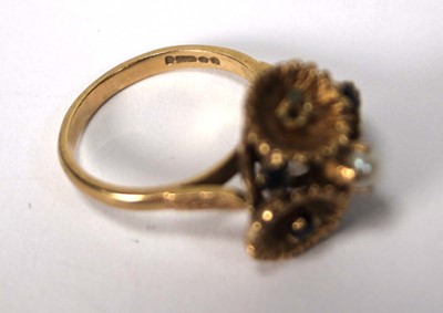 Lot 514 - A 9ct yellow gold ring set small sapphires and...