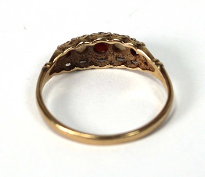 Lot 516 - A 9ct yellow gold ring set garnet and opal,...