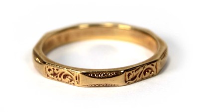 Lot 518 - An 18ct yellow gold facet form and engraved...