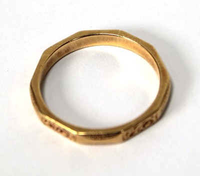 Lot 518 - An 18ct yellow gold facet form and engraved...