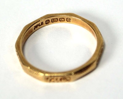 Lot 518 - An 18ct yellow gold facet form and engraved...