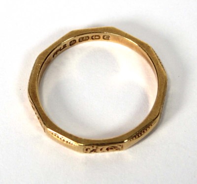 Lot 518 - An 18ct yellow gold facet form and engraved...
