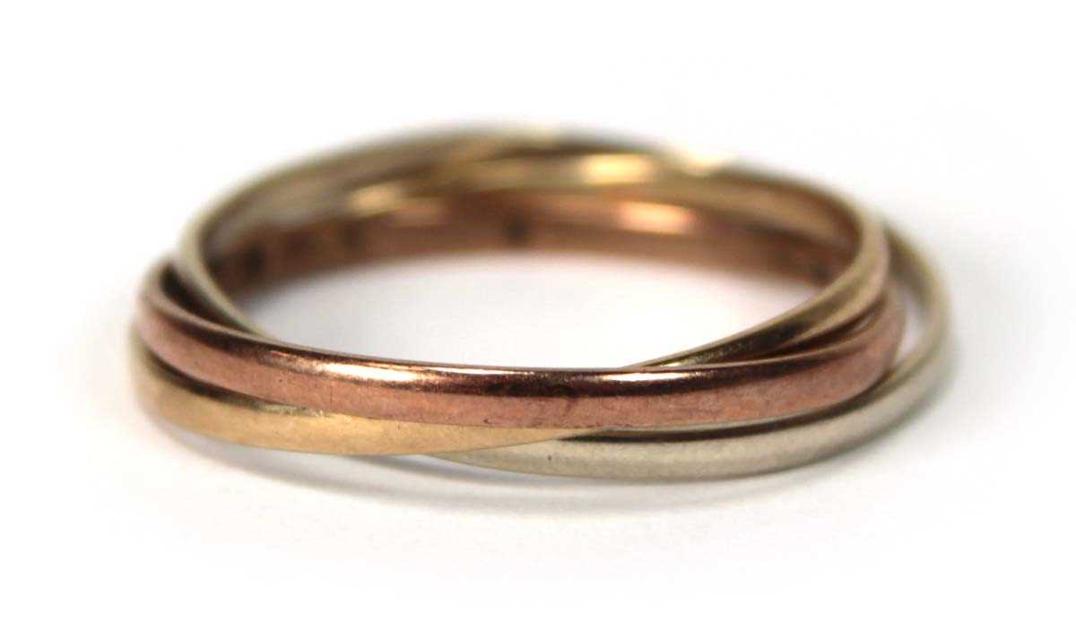 Lot 519 - A 9ct tri-colour triple puzzle type band ring,...