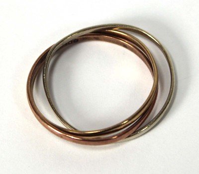 Lot 519 - A 9ct tri-colour triple puzzle type band ring,...