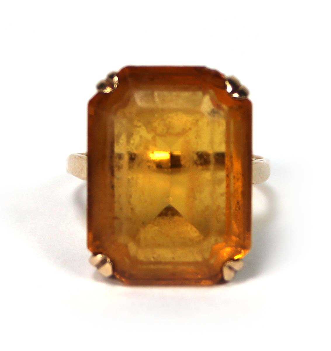 Lot 521 - A 9ct yellow gold dress ring set rectangular...
