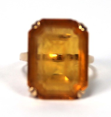 Lot 521 - A 9ct yellow gold dress ring set rectangular...