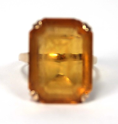 Lot 521 - A 9ct yellow gold dress ring set rectangular...