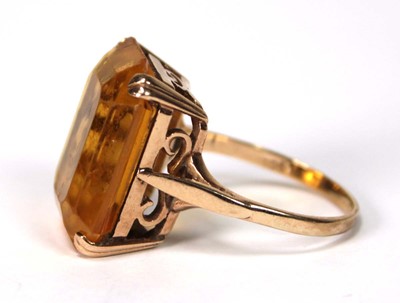 Lot 521 - A 9ct yellow gold dress ring set rectangular...