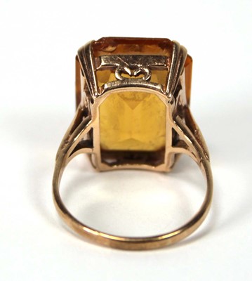 Lot 521 - A 9ct yellow gold dress ring set rectangular...