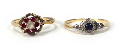 Lot 532 - A 9ct yellow gold dress ring set rubies and...
