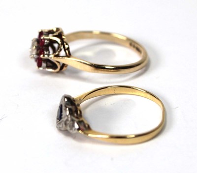 Lot 532 - A 9ct yellow gold dress ring set rubies and...