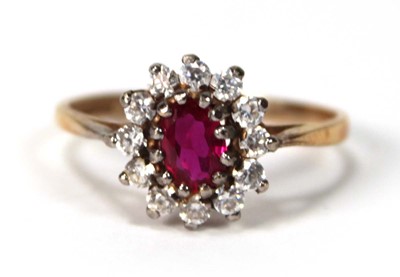 Lot 534 - A 9ct yellow gold cluster ring set ruby and...