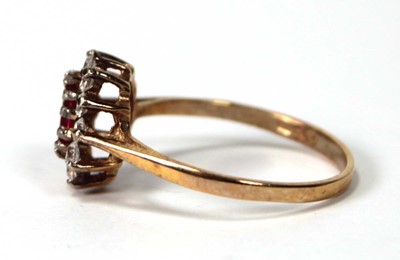 Lot 534 - A 9ct yellow gold cluster ring set ruby and...