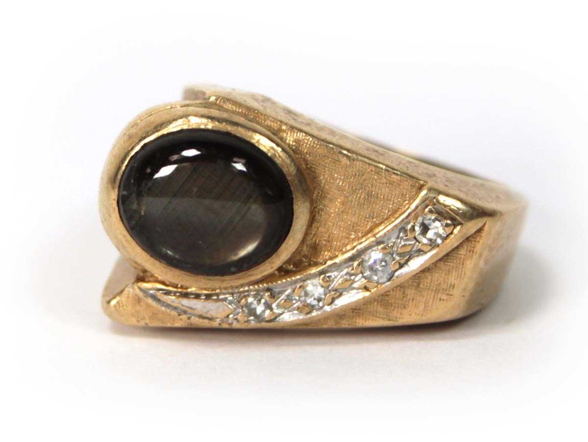 Lot 536 - A 14ct yellow gold ring of abstract design set...