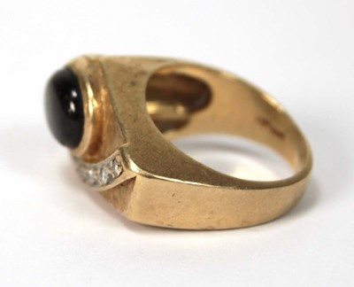 Lot 536 - A 14ct yellow gold ring of abstract design set...
