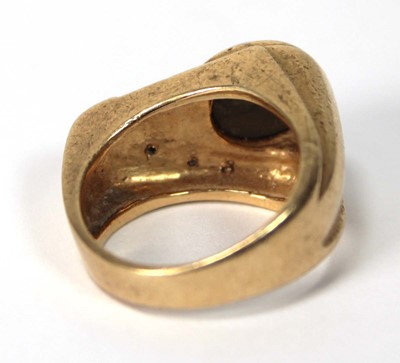 Lot 536 - A 14ct yellow gold ring of abstract design set...